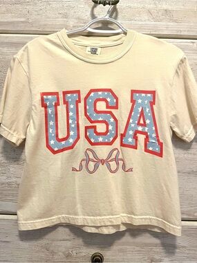 Comfort Colors USA Bow Graphic Tee in Cream with Red & Blue Accents
